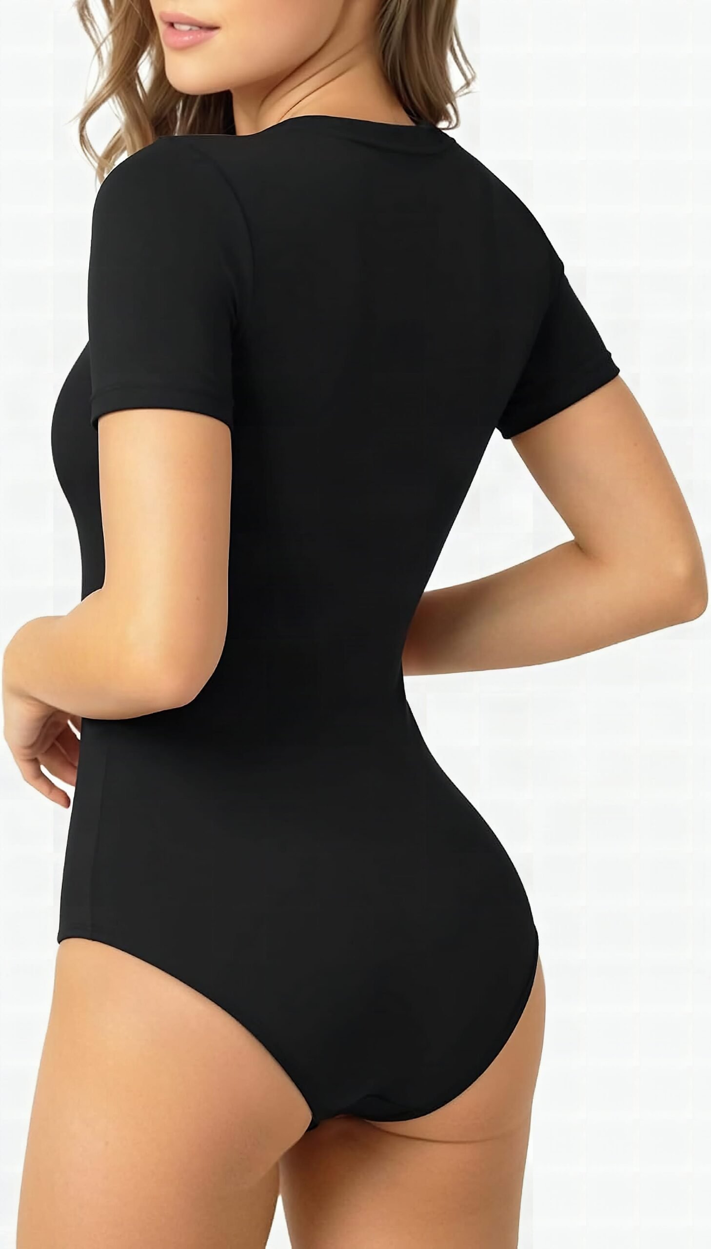 Close-up of snap detail buttons on MANGOPOP bodysuit neckline against cream fabric